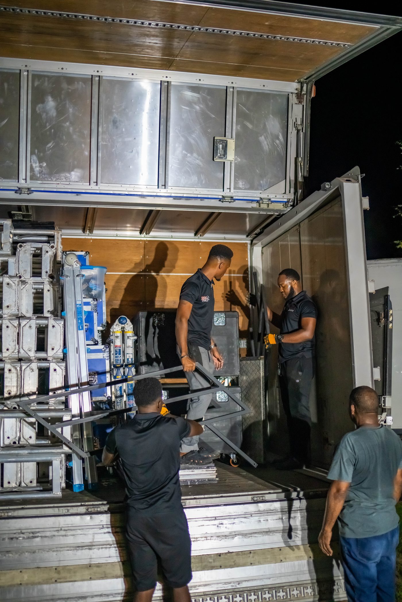 Truss being unloaded from the truck at night