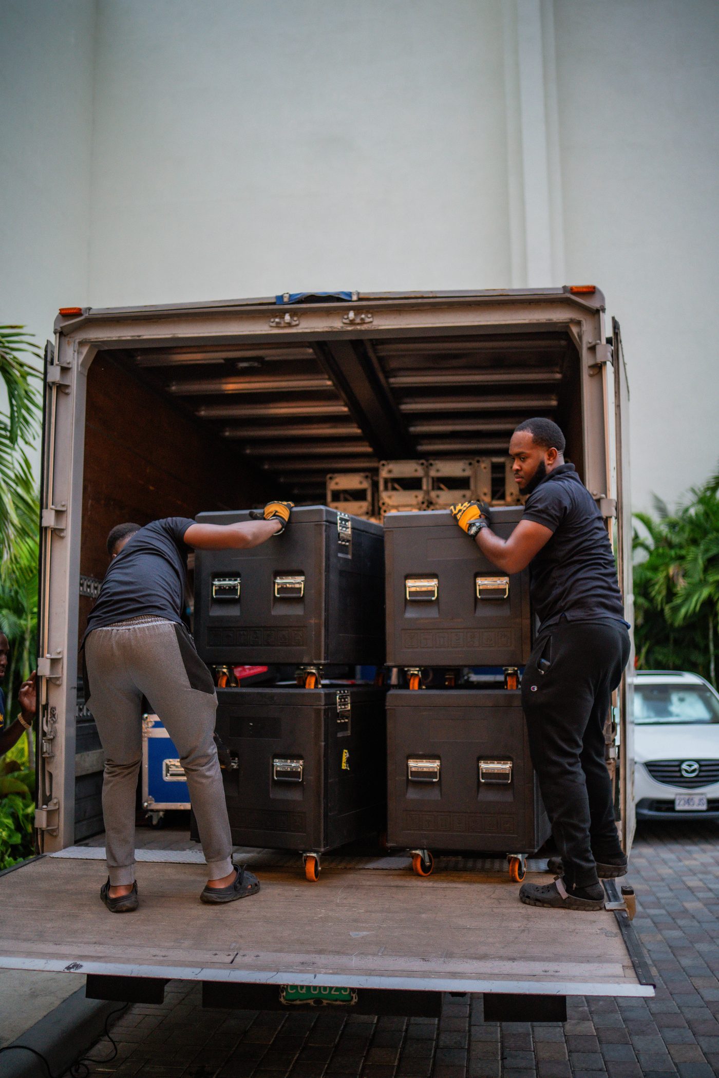 Flight cases coming off the truck