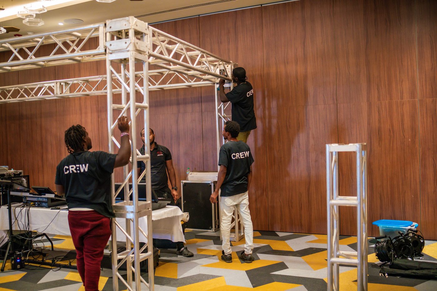 Sound It Up crew assembling a truss goalpost before a conference