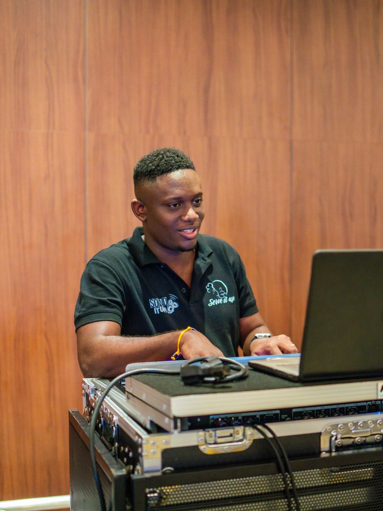 Sound It Up engineer running show control from a laptop
